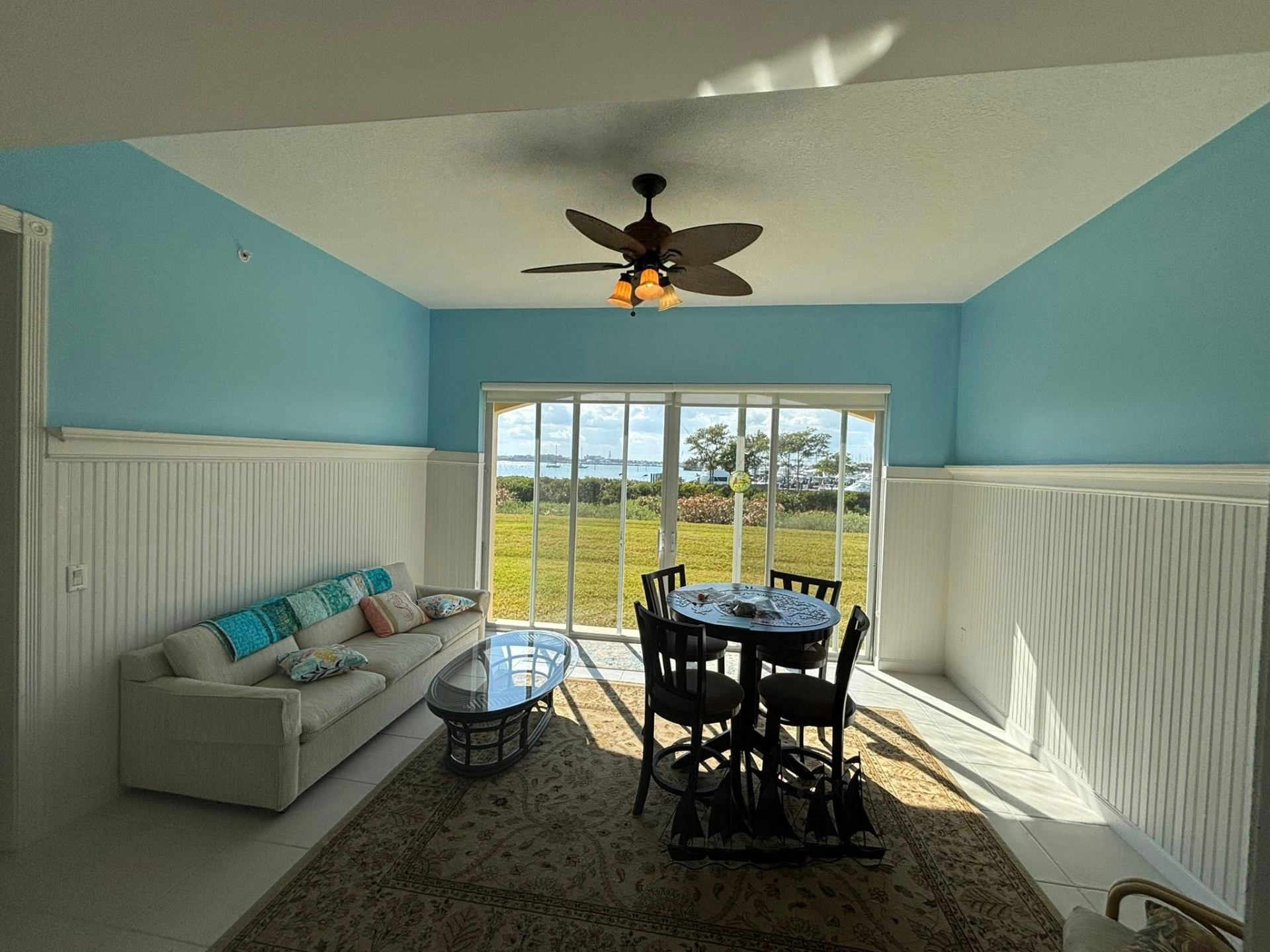 Interior repaint of a bright waterfront living room in a Treasure Coast condo by Millman Services.