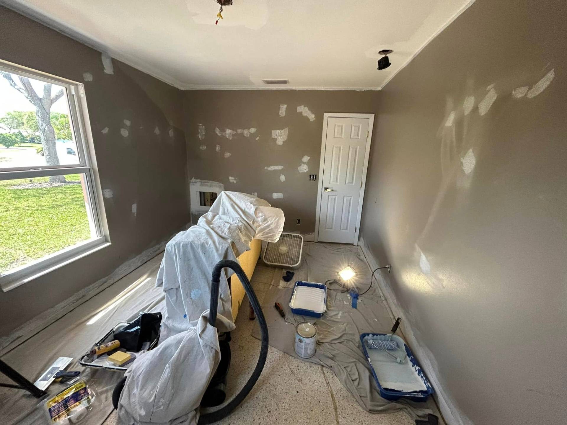 Drywall repair and smooth wall prep in a Treasure Coast home by Millman Services.